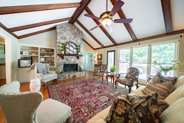 6130 Bristol Blvd, Columbus, GA 31904 - living area featuring light wood-style flooring, a fireplace, beam ceiling, a ceiling fan, and high vaulted ceiling