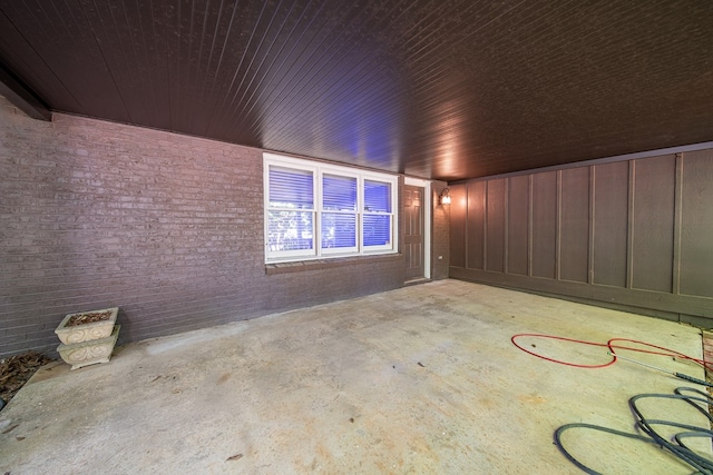 6130 Bristol Blvd, Columbus, GA 31904 - spare room featuring concrete flooring and brick wall