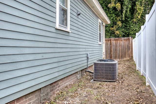exterior view of central air condition unit and fence