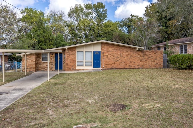 single story home featuring a front yard and a carport