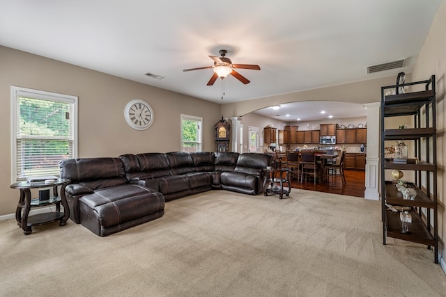 51 New Castle Dr, Phenix City, AL 36870 - living room with arched walkways, light colored carpet, decorative columns, a ceiling fan, and recessed lighting