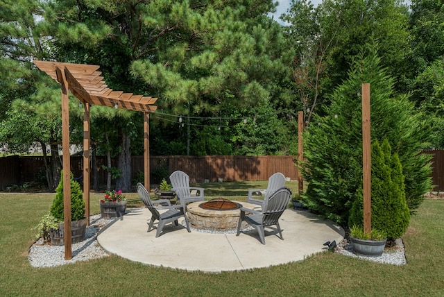 51 New Castle Dr, Phenix City, AL 36870 - fenced backyard featuring a fire pit and a patio area