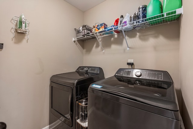 51 New Castle Dr, Phenix City, AL 36870 - laundry area with washer and dryer and baseboards