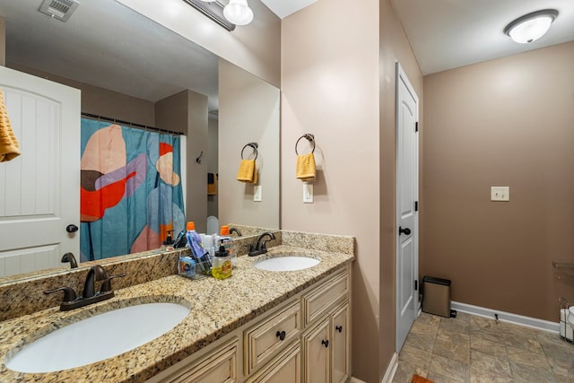 51 New Castle Dr, Phenix City, AL 36870 - bathroom with double vanity and stone finish flooring