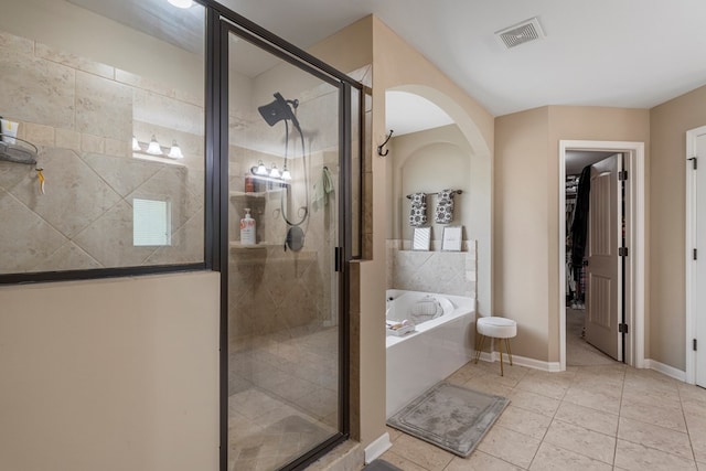 51 New Castle Dr, Phenix City, AL 36870 - full bathroom featuring a bath, a shower stall, and tile patterned floors