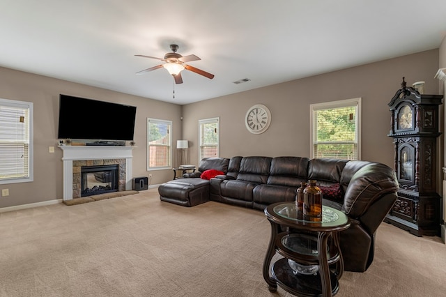 51 New Castle Dr, Phenix City, AL 36870 - carpeted living room with a ceiling fan and a glass covered fireplace