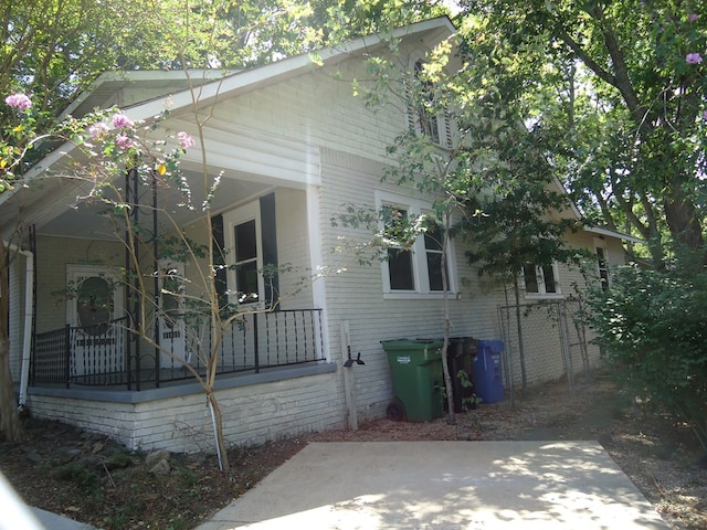 view of home's exterior featuring a porch