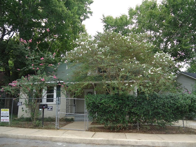 view of property hidden behind natural elements