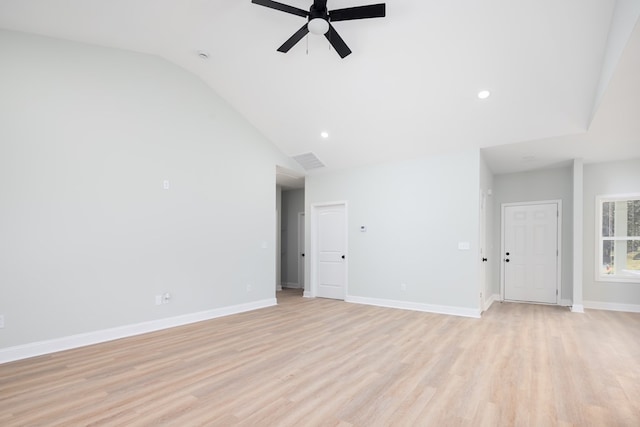 unfurnished room with visible vents, light wood-style flooring, baseboards, lofted ceiling, and ceiling fan