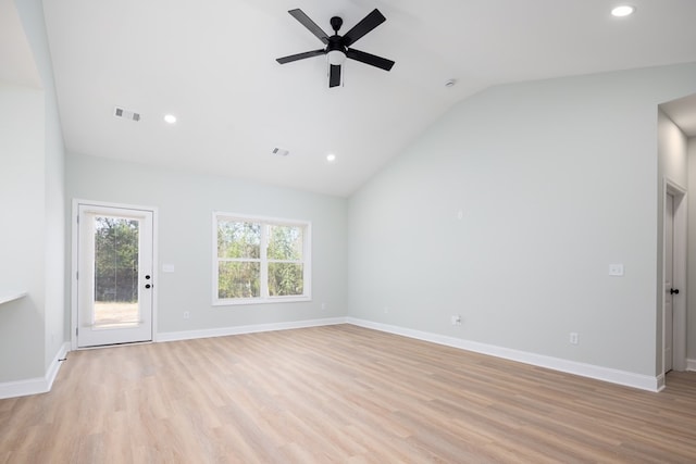 unfurnished living room featuring visible vents, lofted ceiling, light wood-style floors, and baseboards