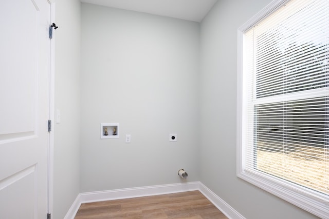 washroom with baseboards, washer hookup, laundry area, wood finished floors, and electric dryer hookup