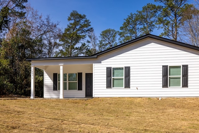 exterior space with a yard