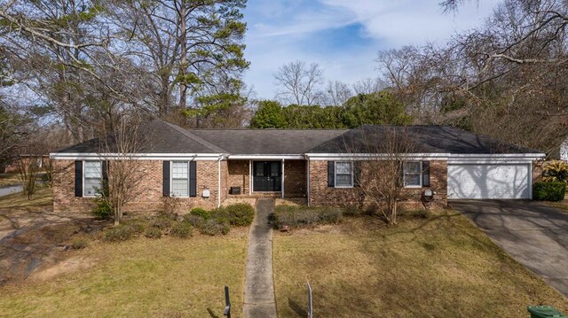 6138 Seaton Dr, Columbus, GA 31909 - ranch-style house featuring driveway, brick siding, an attached garage, and a front yard