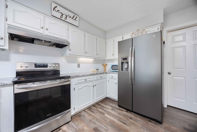 6138 Seaton Dr, Columbus, GA 31909 - kitchen featuring appliances with stainless steel finishes, under cabinet range hood, white cabinets, and light wood-style floors