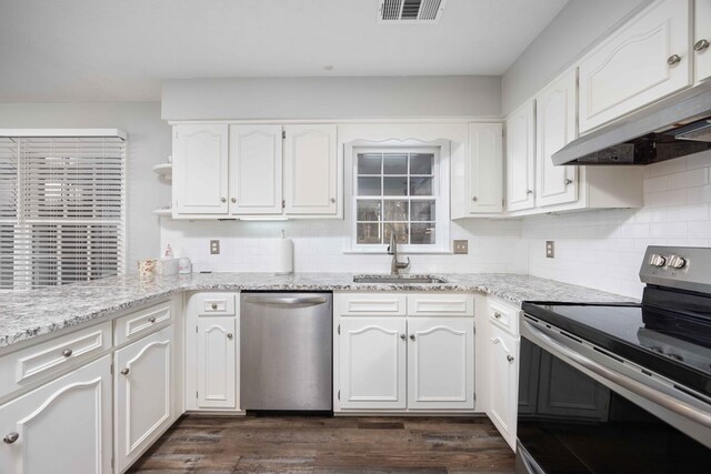 6138 Seaton Dr, Columbus, GA 31909 - kitchen with appliances with stainless steel finishes, range hood, white cabinetry, and dark wood-style flooring