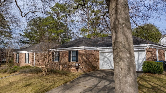 6138 Seaton Dr, Columbus, GA 31909 - view of front of home with concrete driveway, brick siding, and an attached garage