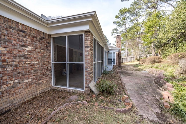 6138 Seaton Dr, Columbus, GA 31909 - view of side of home with brick siding and a patio area