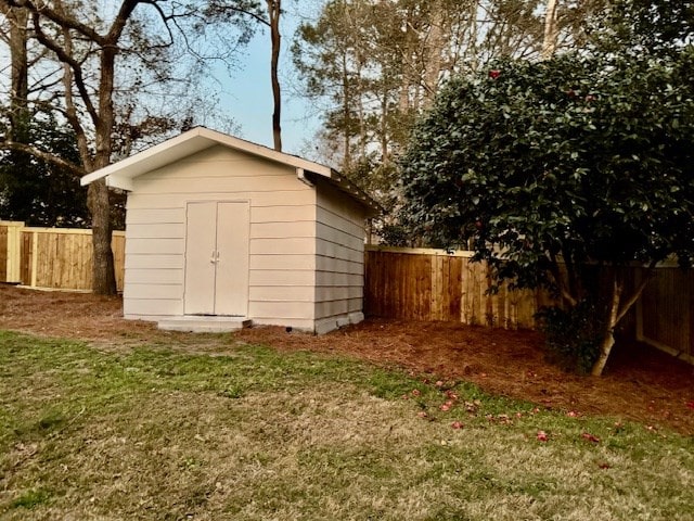 view of shed featuring a fenced backyard