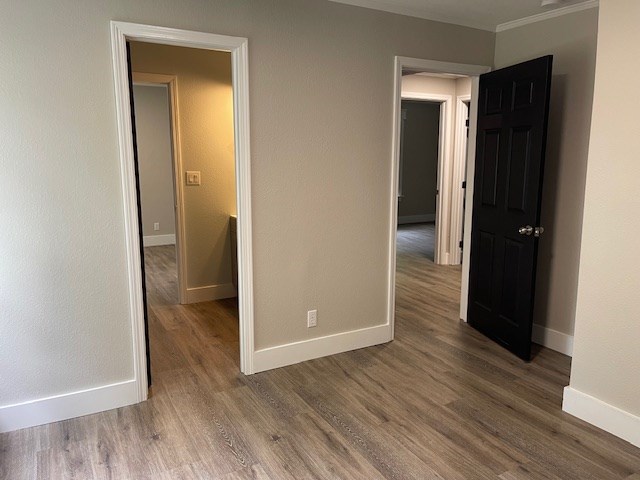 62 Brannon Montgomery Rd, Mauk, GA 31058 - unfurnished bedroom featuring baseboards, ornamental molding, and wood finished floors