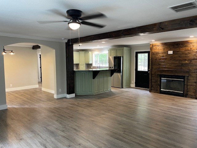 62 Brannon Montgomery Rd, Mauk, GA 31058 - unfurnished living room featuring ceiling fan, visible vents, ornamental molding, and baseboards