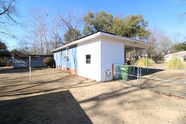 view of side of home featuring cooling unit