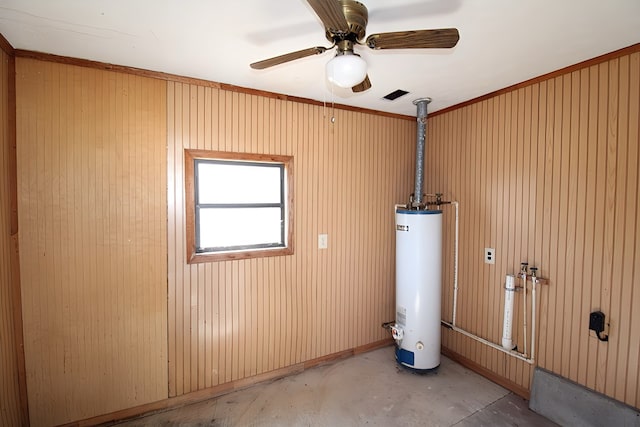 utility room featuring gas water heater