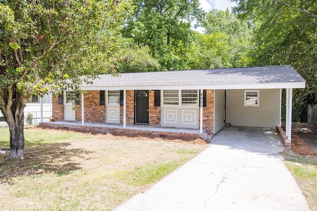 ranch-style home featuring an attached carport, driveway, a porch, and brick siding
