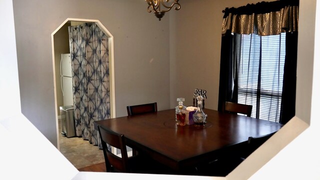 908 Arlington Dr, Columbus, GA 31907 - dining area featuring a chandelier and arched walkways