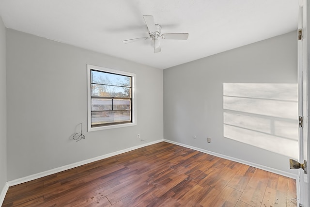 empty room featuring ceiling fan and hardwood / wood-style floors