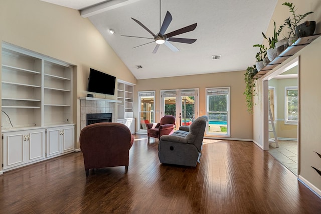 7096 Southwind Ct, Columbus, GA 31909 - living room with a fireplace, a ceiling fan, dark wood-style flooring, baseboards, and high vaulted ceiling