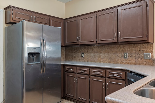 7096 Southwind Ct, Columbus, GA 31909 - kitchen featuring stainless steel fridge with ice dispenser, dark brown cabinets, light countertops, and tasteful backsplash