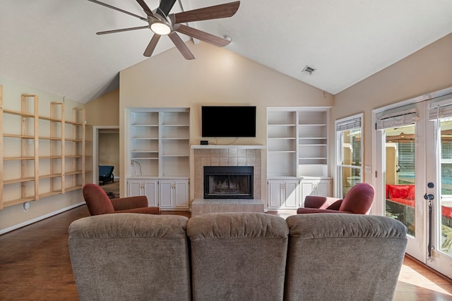 7096 Southwind Ct, Columbus, GA 31909 - living room with ceiling fan, built in features, wood finished floors, a fireplace, and high vaulted ceiling