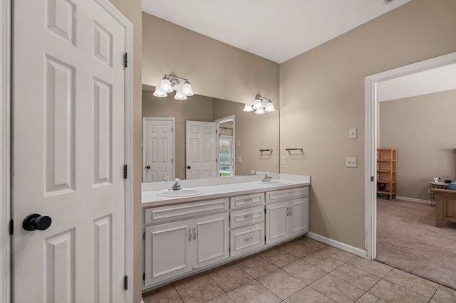 7096 Southwind Ct, Columbus, GA 31909 - bathroom featuring double vanity, tile patterned floors, and baseboards