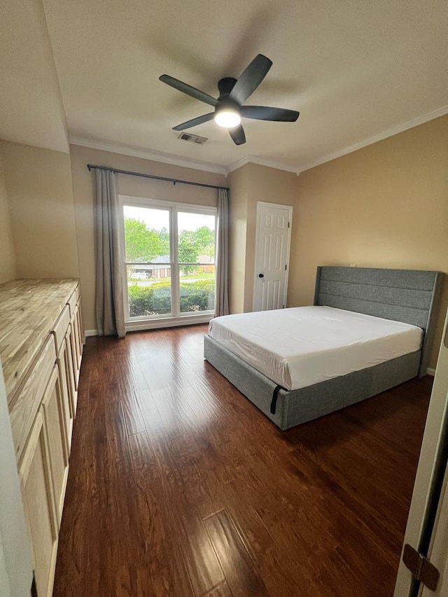 7096 Southwind Ct, Columbus, GA 31909 - bedroom with crown molding, dark wood-type flooring, a ceiling fan, and baseboards