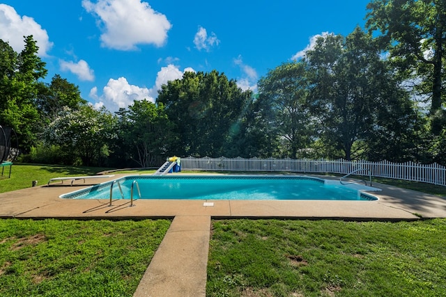 7096 Southwind Ct, Columbus, GA 31909 - view of swimming pool with a patio, view of wooded area, and a diving board