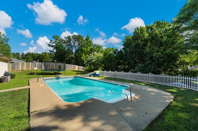7096 Southwind Ct, Columbus, GA 31909 - view of pool featuring a trampoline, a patio, a diving board, and view of wooded area
