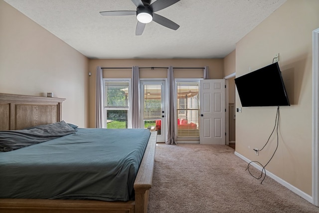 7096 Southwind Ct, Columbus, GA 31909 - carpeted bedroom featuring access to outside, a textured ceiling, baseboards, and ceiling fan