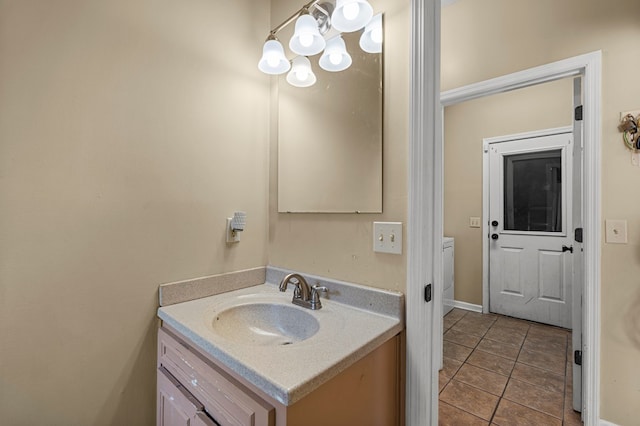 7096 Southwind Ct, Columbus, GA 31909 - bathroom with vanity, tile patterned floors, and a chandelier