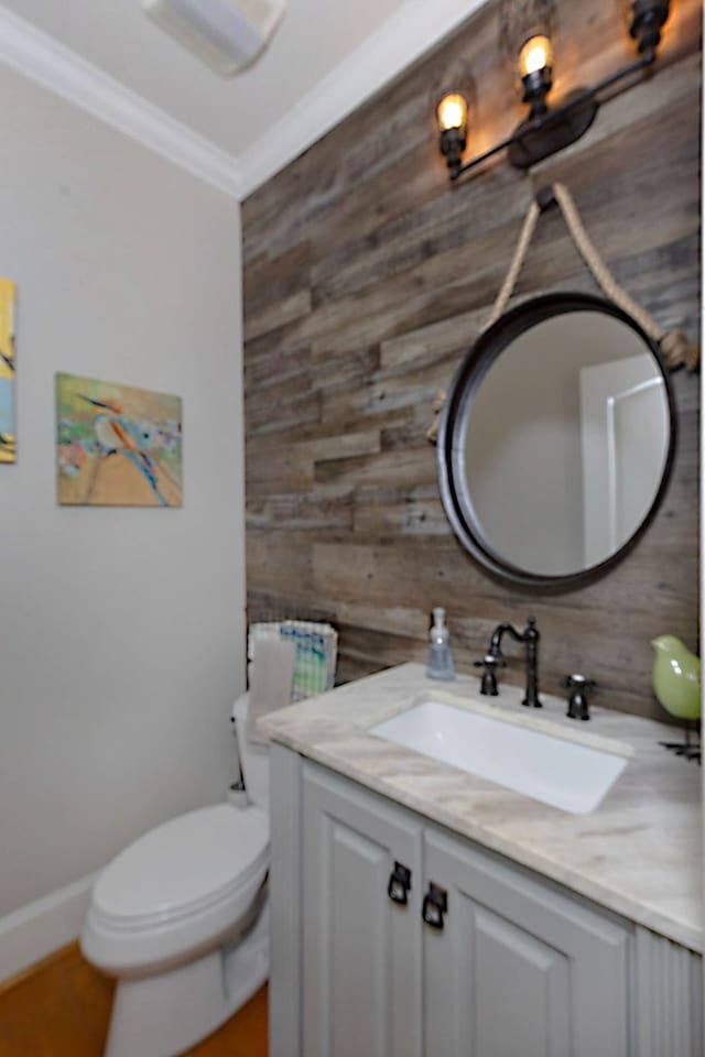 5023 Masters Ln, Columbus, GA 31909 - half bathroom featuring wood walls, vanity, and ornamental molding
