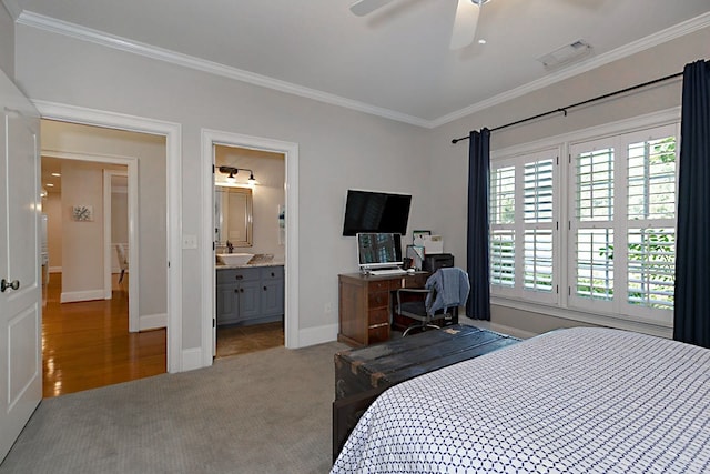 5023 Masters Ln, Columbus, GA 31909 - carpeted bedroom with crown molding, multiple windows, ceiling fan, and ensuite bath
