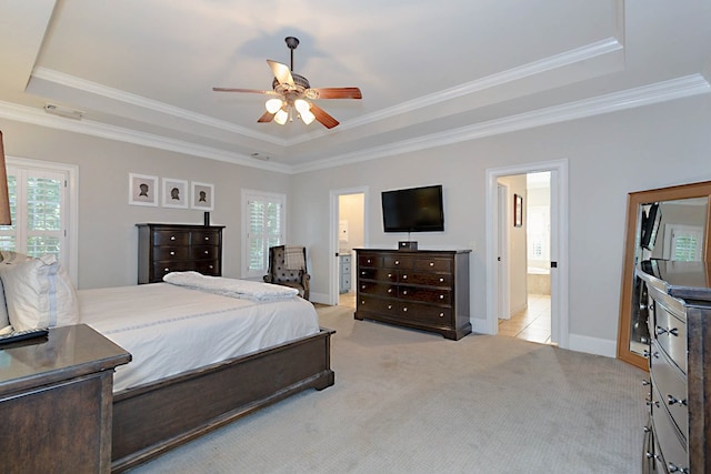 5023 Masters Ln, Columbus, GA 31909 - bedroom featuring a tray ceiling, multiple windows, light carpet, and crown molding