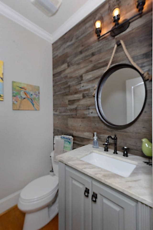5023 Masters Ln, Columbus, GA 31909 - half bath featuring vanity, wooden walls, and ornamental molding