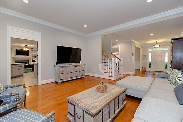 5023 Masters Ln, Columbus, GA 31909 - living area featuring stairs, ornamental molding, recessed lighting, and light wood-style flooring