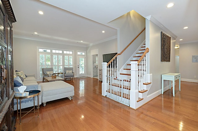 5023 Masters Ln, Columbus, GA 31909 - living area with wood finished floors, ornamental molding, stairway, and recessed lighting