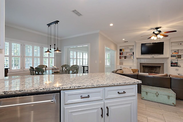 5023 Masters Ln, Columbus, GA 31909 - kitchen with stainless steel dishwasher, a fireplace, light stone counters, a ceiling fan, and crown molding