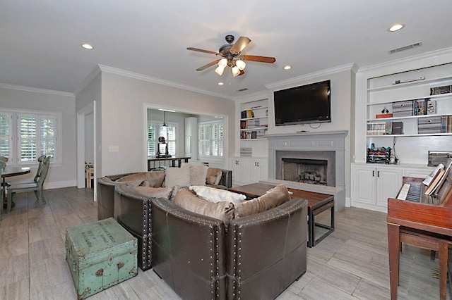 5023 Masters Ln, Columbus, GA 31909 - living area with ceiling fan, a high end fireplace, crown molding, built in features, and recessed lighting