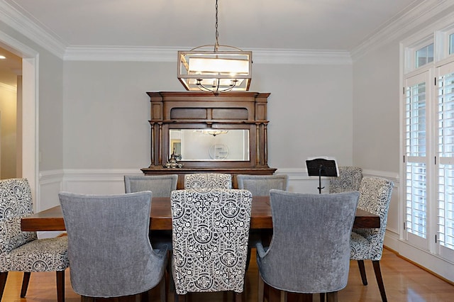 5023 Masters Ln, Columbus, GA 31909 - dining area with ornamental molding, plenty of natural light, wood finished floors, a chandelier, and a wainscoted wall