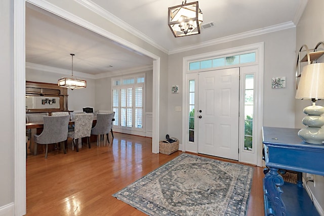 5023 Masters Ln, Columbus, GA 31909 - entryway with a chandelier, wood finished floors, and crown molding