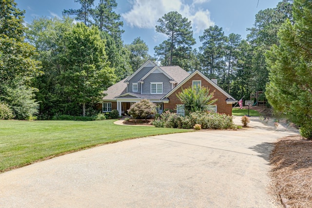 5023 Masters Ln, Columbus, GA 31909 - view of front facade with driveway, a front lawn, and brick siding