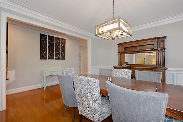 5023 Masters Ln, Columbus, GA 31909 - dining room with a chandelier, wood finished floors, and crown molding